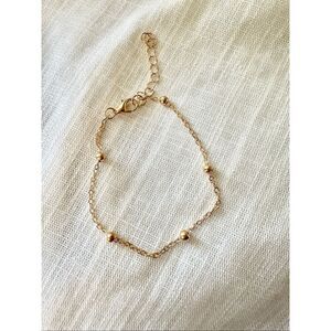 Delicate Gold color chain-link with gold color ball embellishment bracelet with